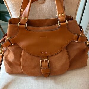 Aimee leather bag with many pockets and closures. Very strong magnets. 17” X 15”